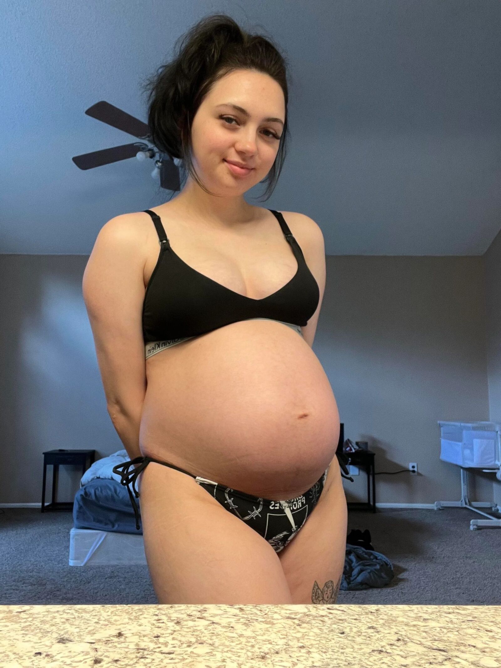 Pregnant young mom at home