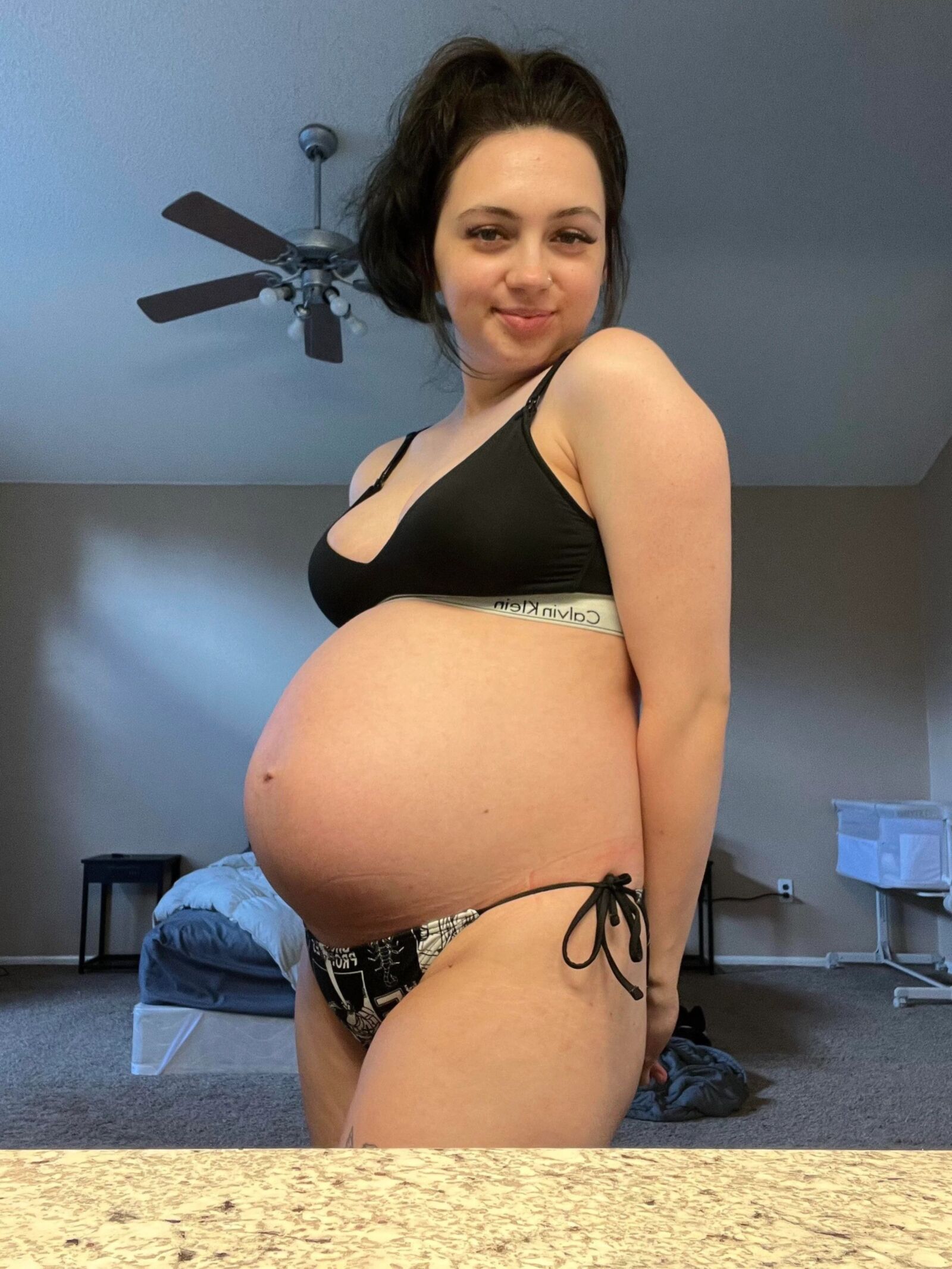 Pregnant young mom at home