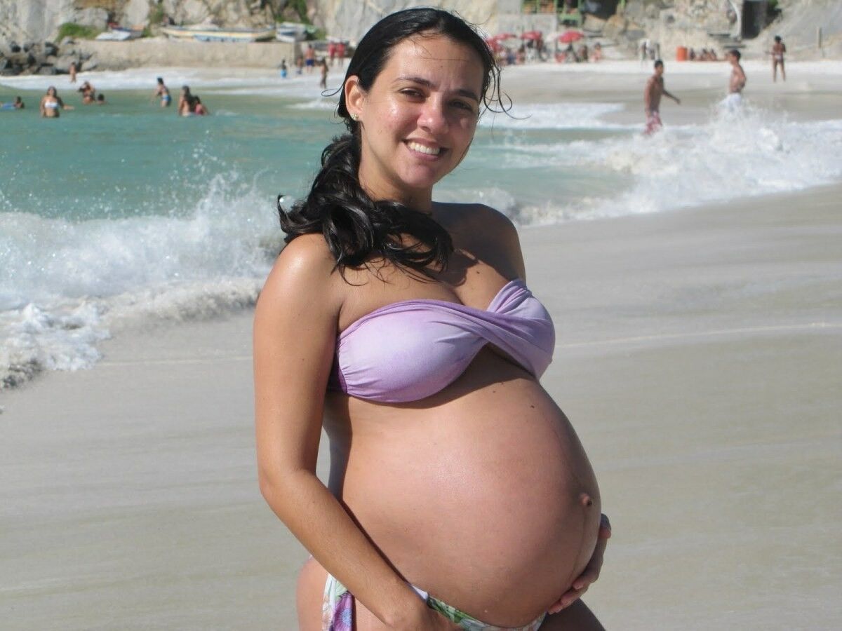 April 24 pregnant in swimwear