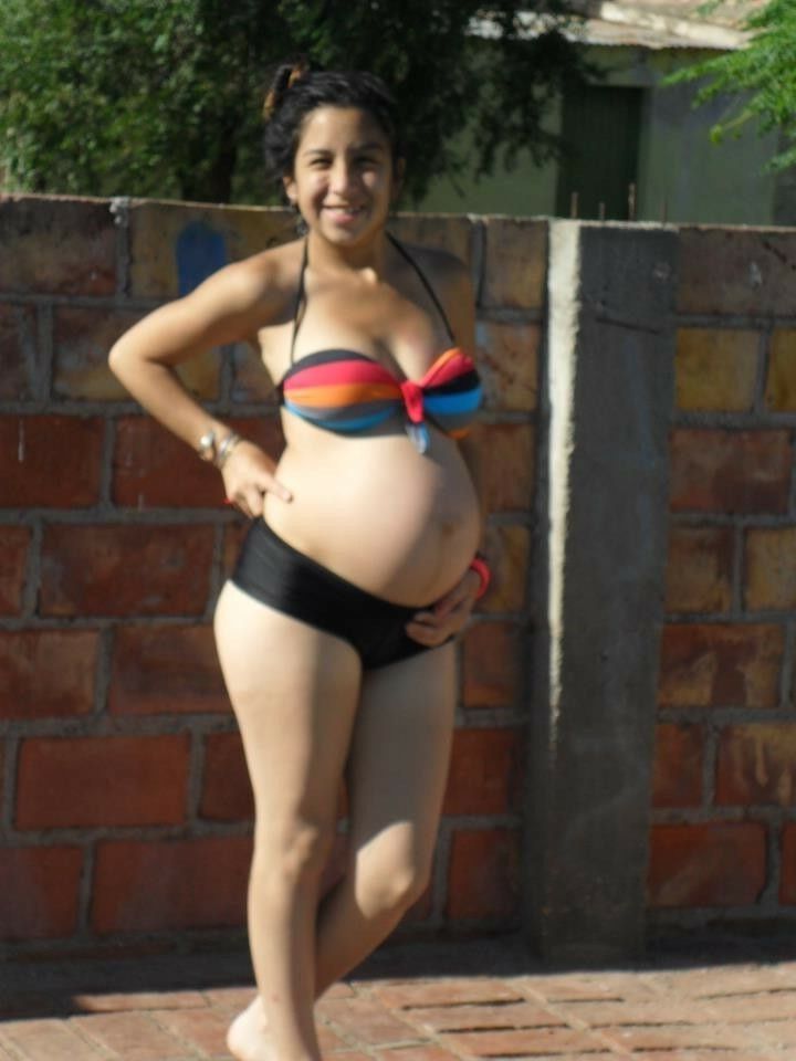 April 24 pregnant in swimwear