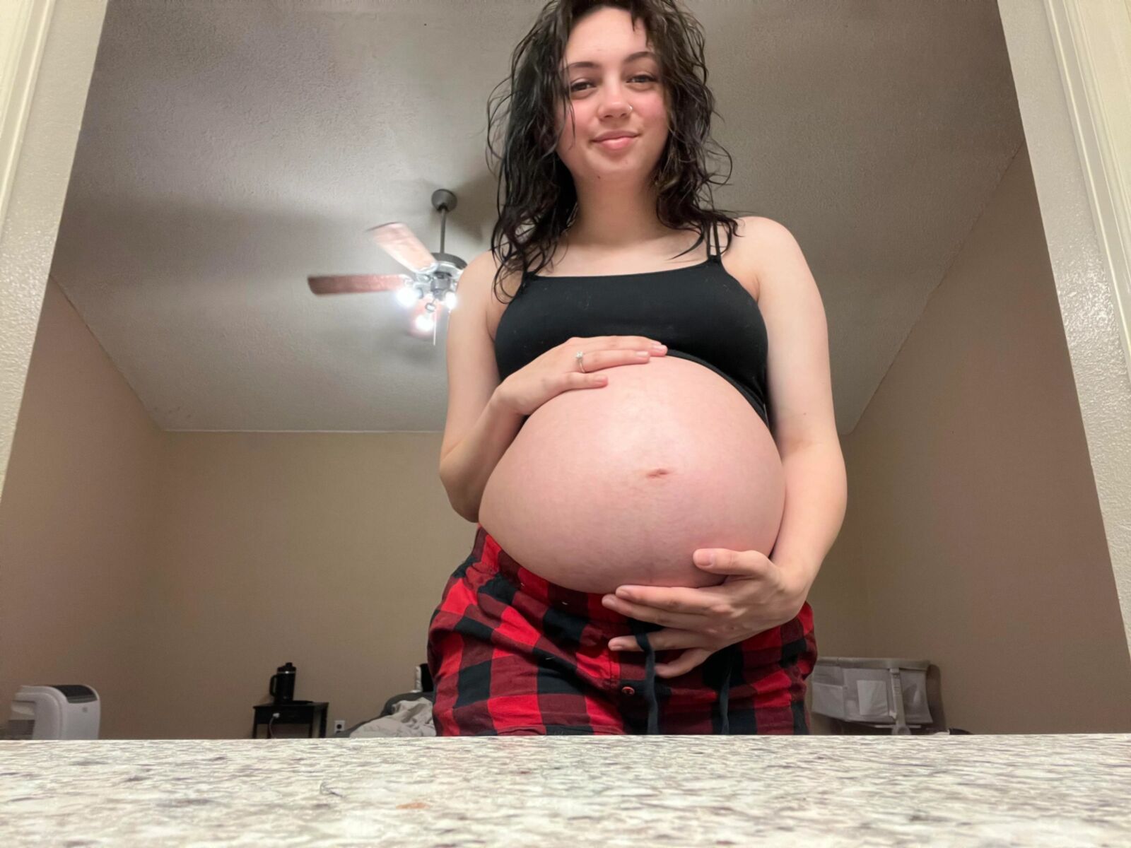 Pregnant young mom at home