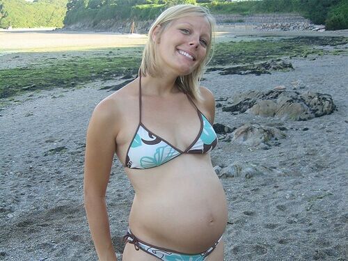 April 24 pregnant in swimwear