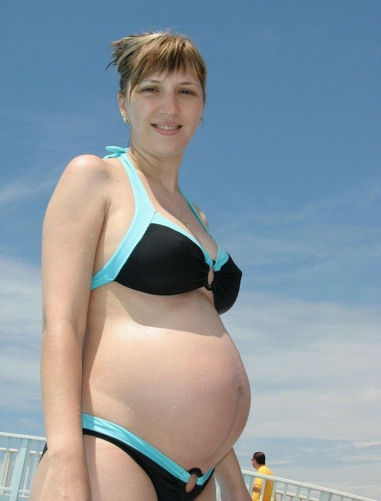 April 24 pregnant in swimwear