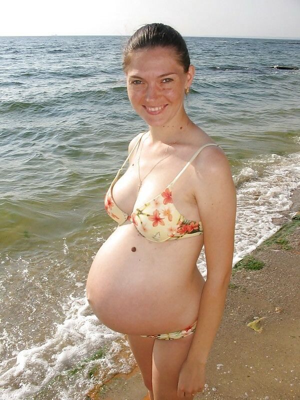 April 24 pregnant in swimwear