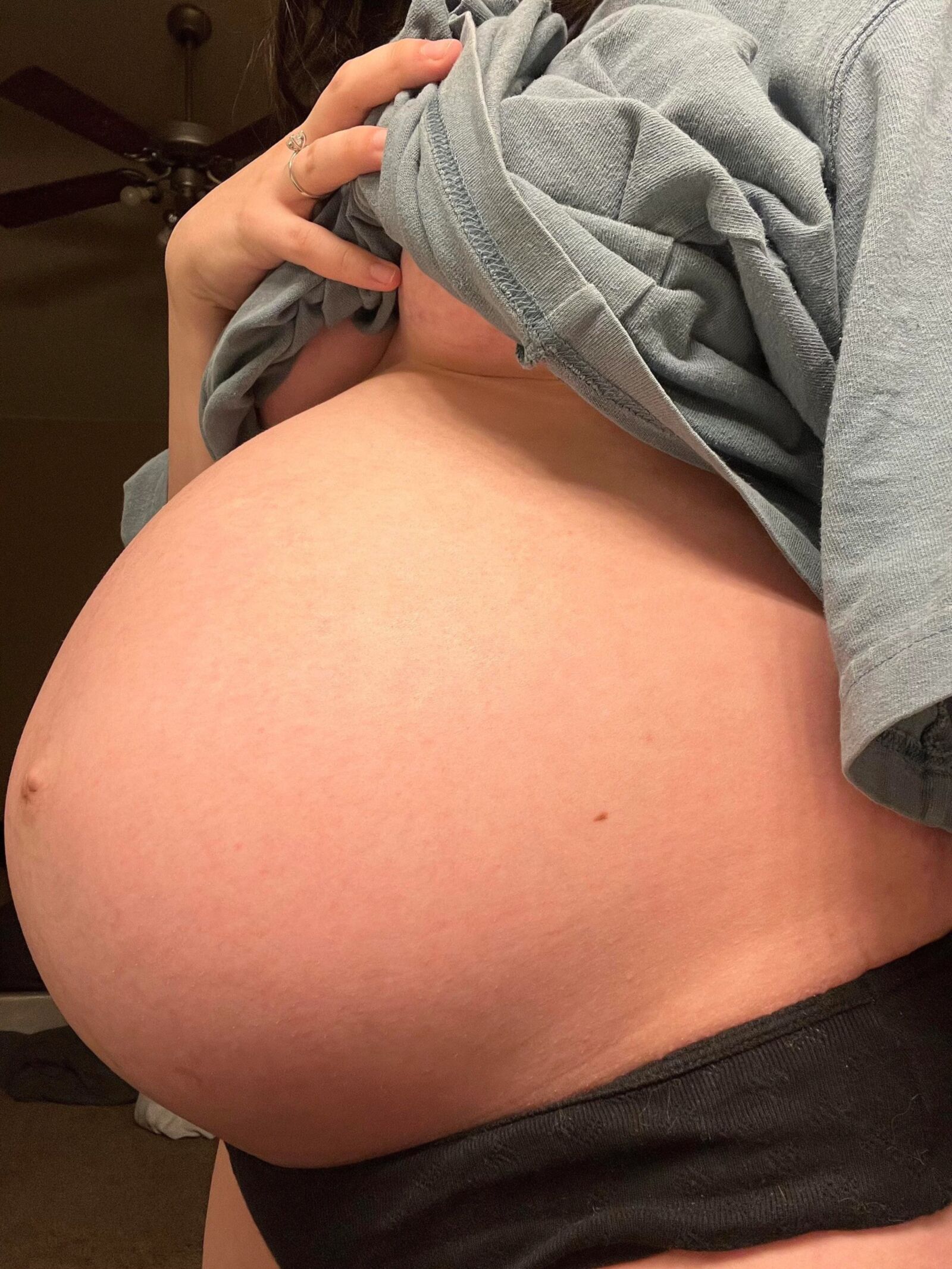 Pregnant young mom at home