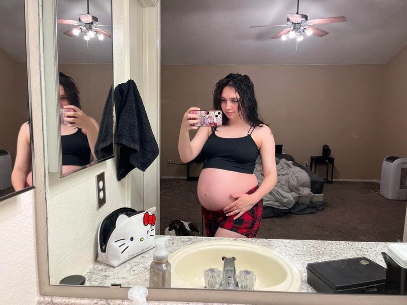 Pregnant young mom at home