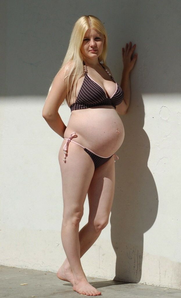 April 24 pregnant in swimwear