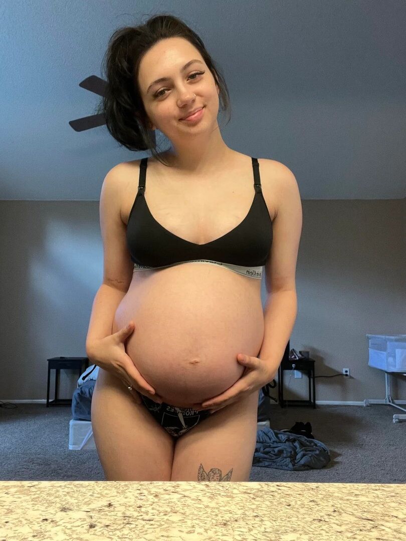 Pregnant young mom at home