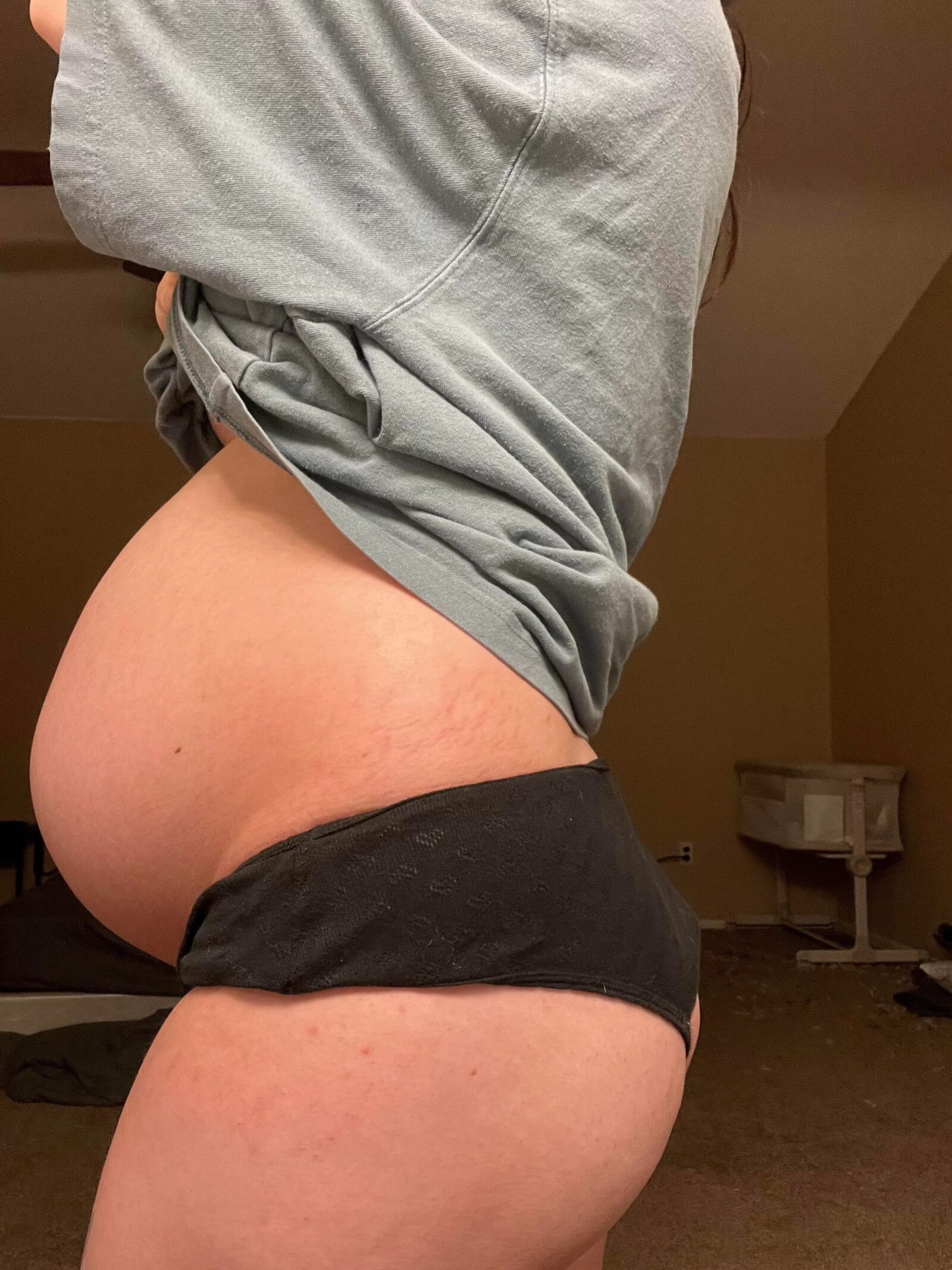 Pregnant young mom at home