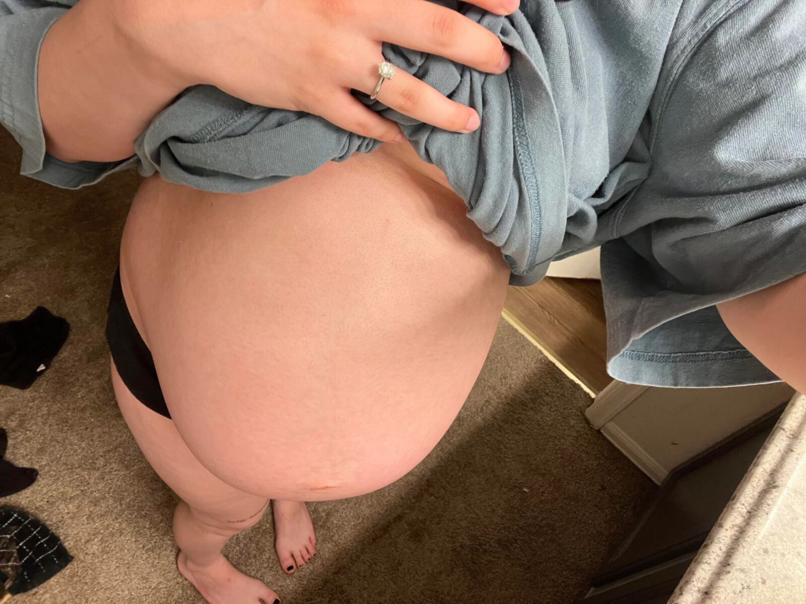 Pregnant young mom at home