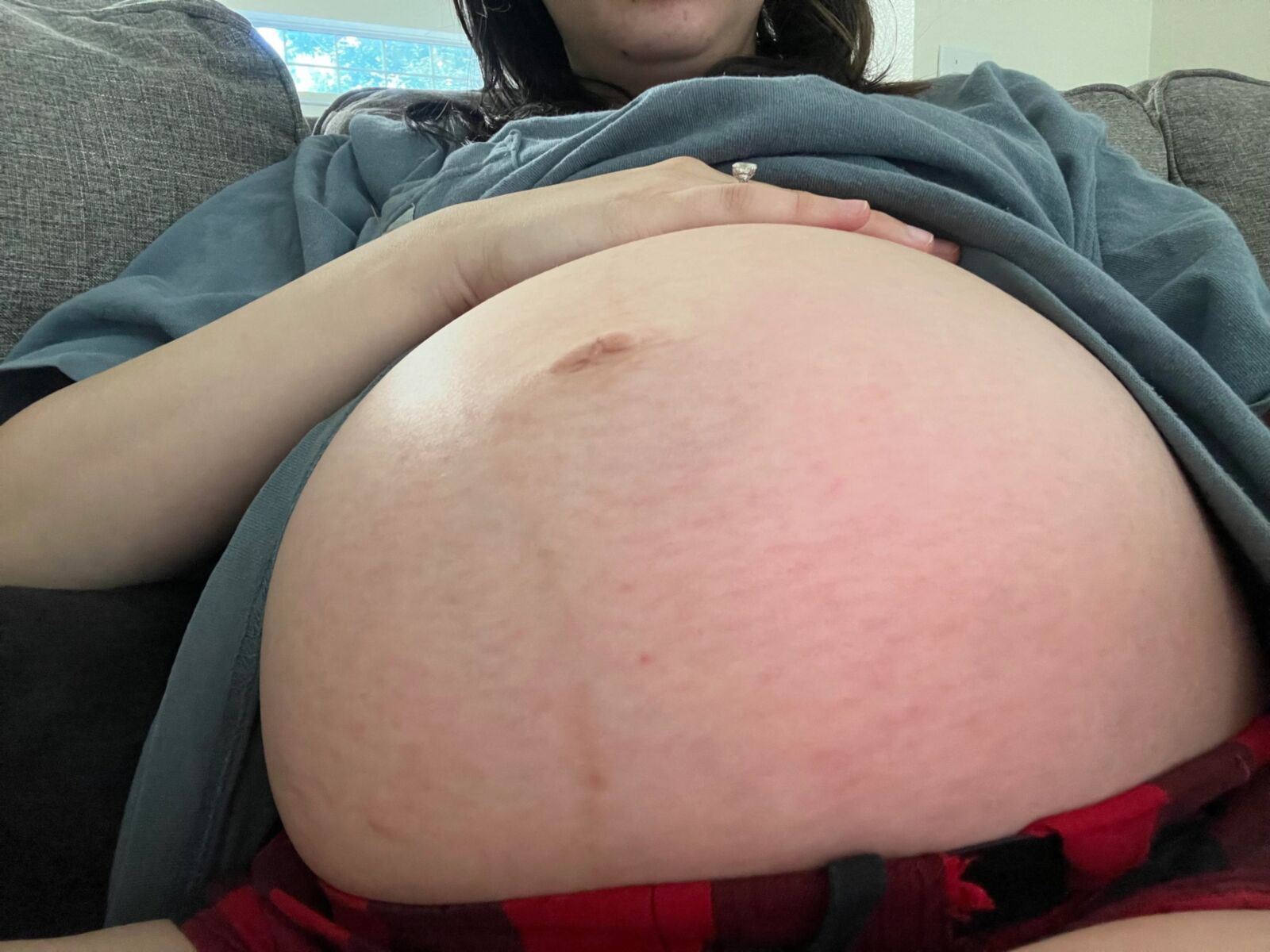 Pregnant young mom at home