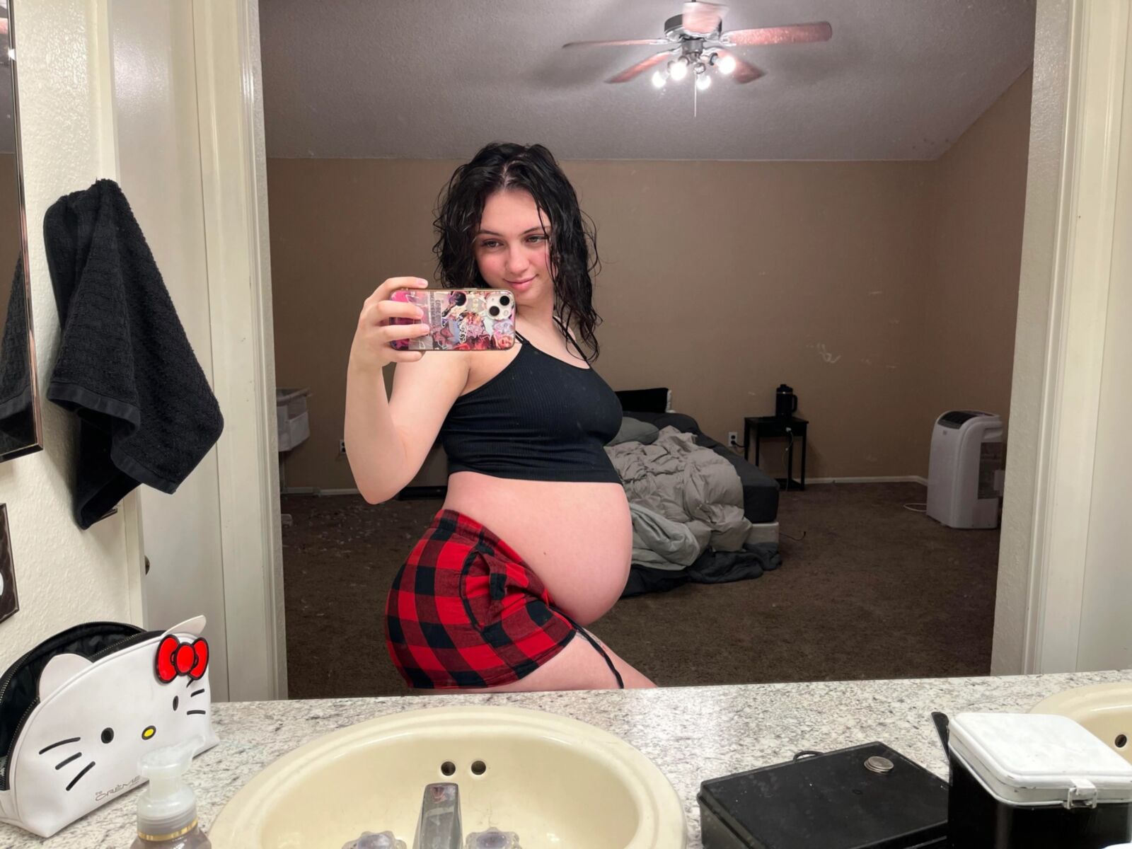 Pregnant young mom at home