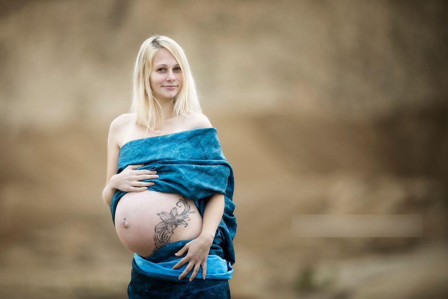 Hot photo shoot of a young pregnant blonde