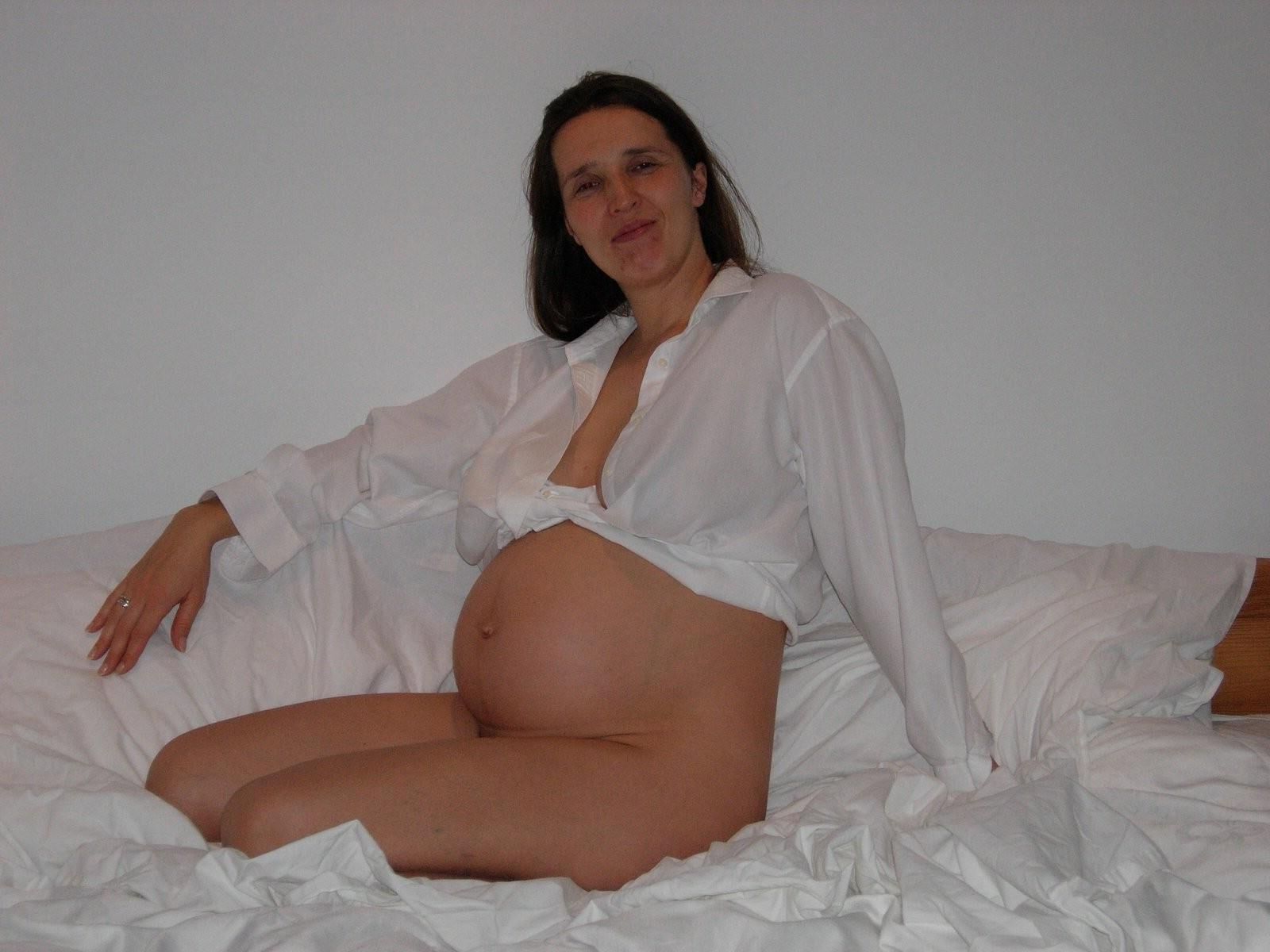 [Pregnant] woman in her bedroom