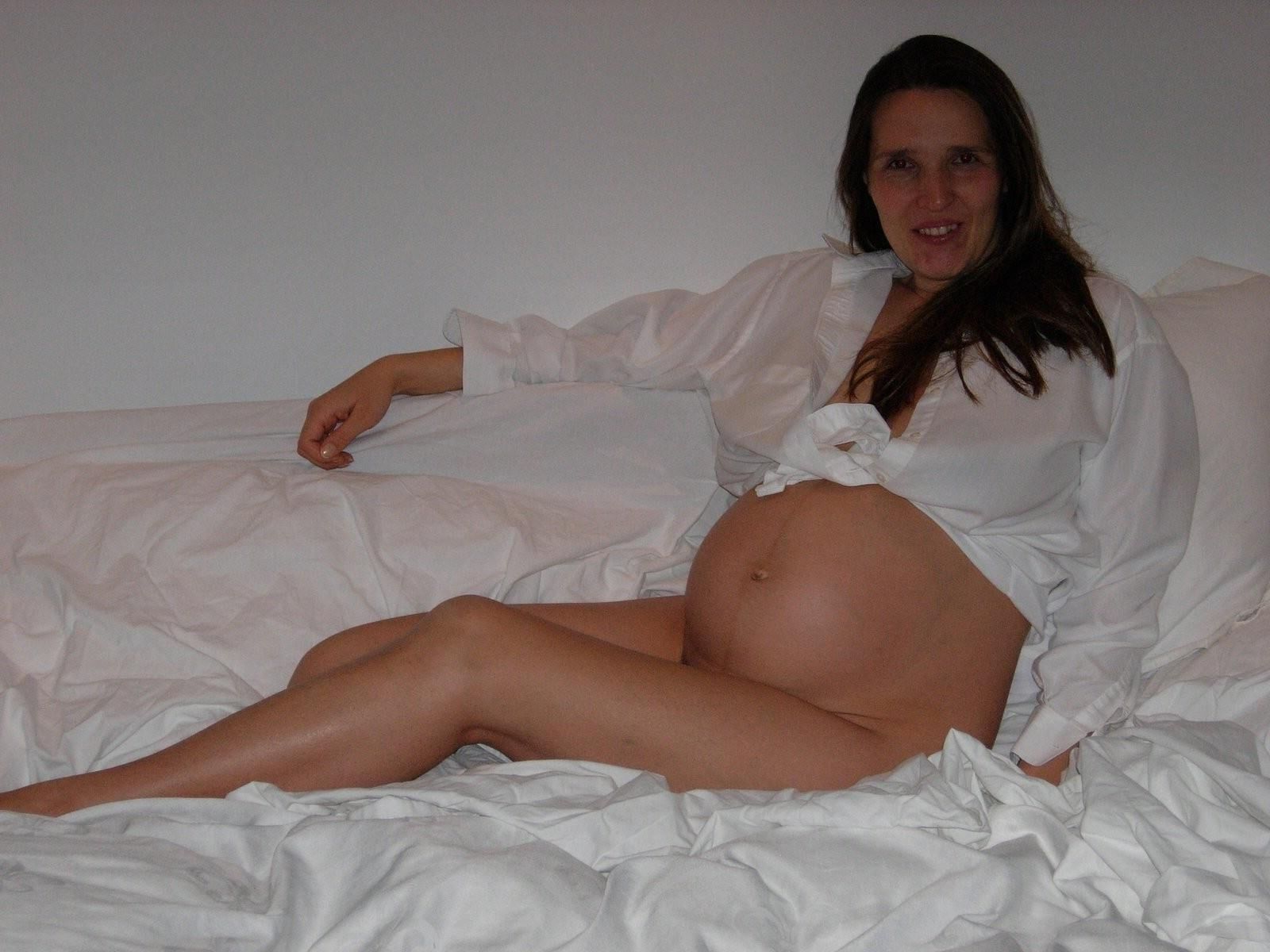 [Pregnant] woman in her bedroom