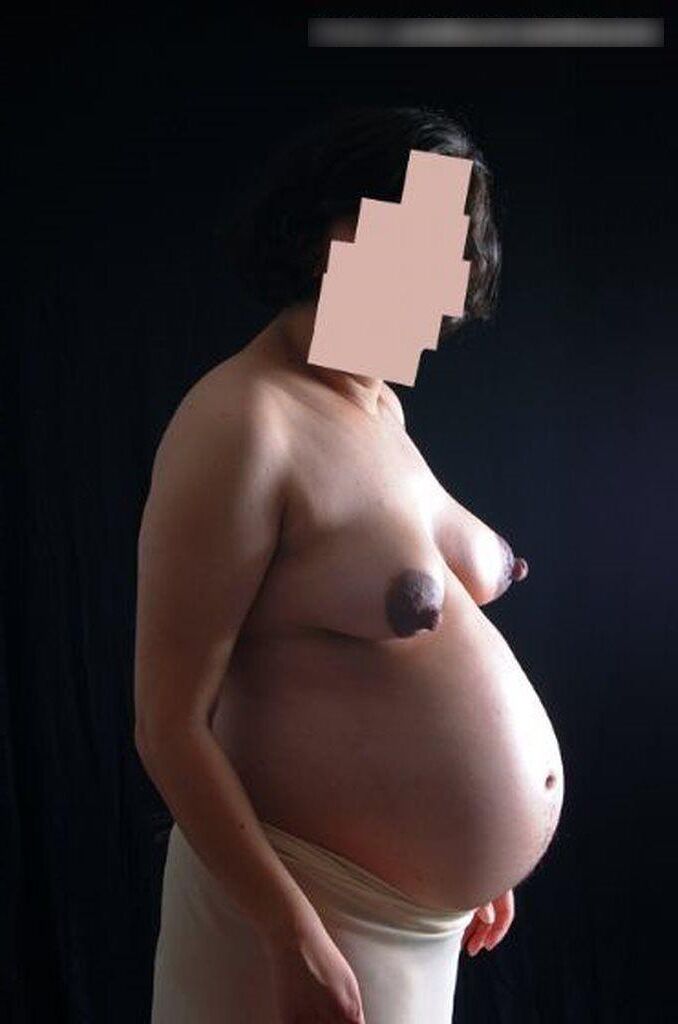 Photo shoot of a naked and anonymous pregnant woman