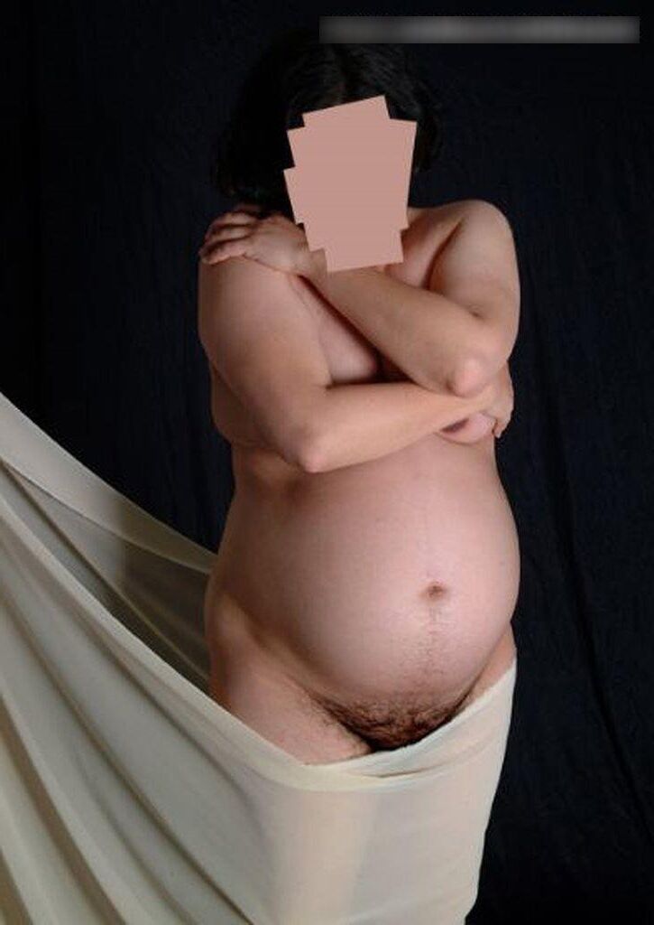 Photo shoot of a naked and anonymous pregnant woman