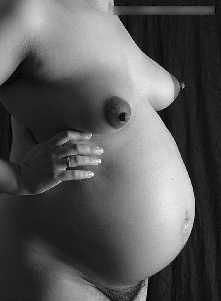 Photo shoot of a naked and anonymous pregnant woman