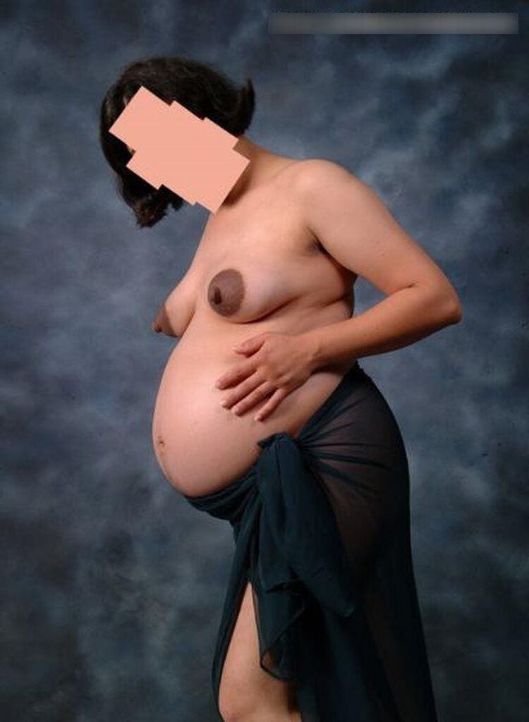 Photo shoot of a naked and anonymous pregnant woman