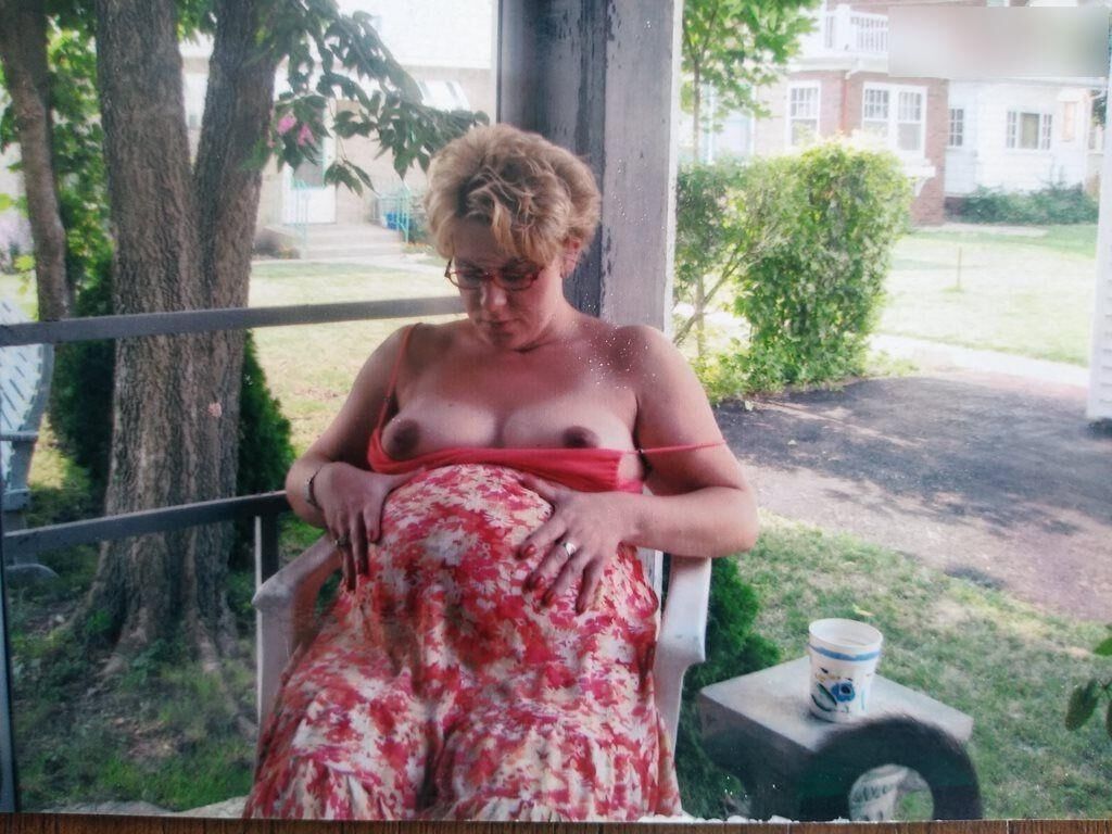 Pregnant woman shows herself at home