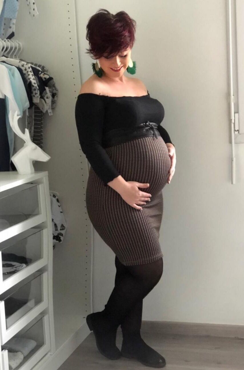 [Pregnant] woman very proud to show off her big belly