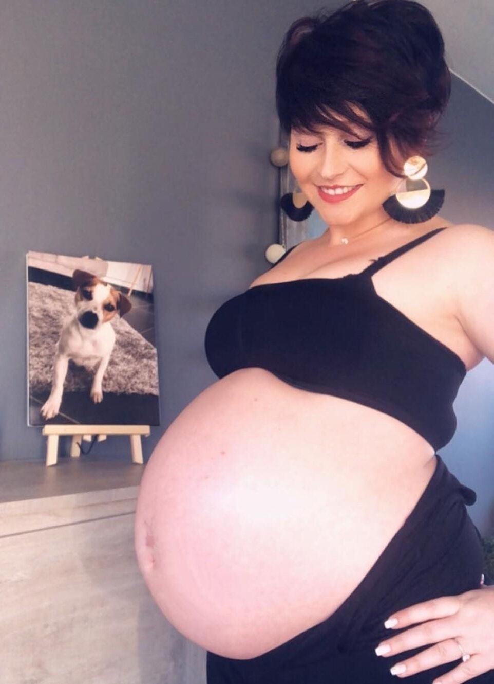 [Pregnant] woman very proud to show off her big belly