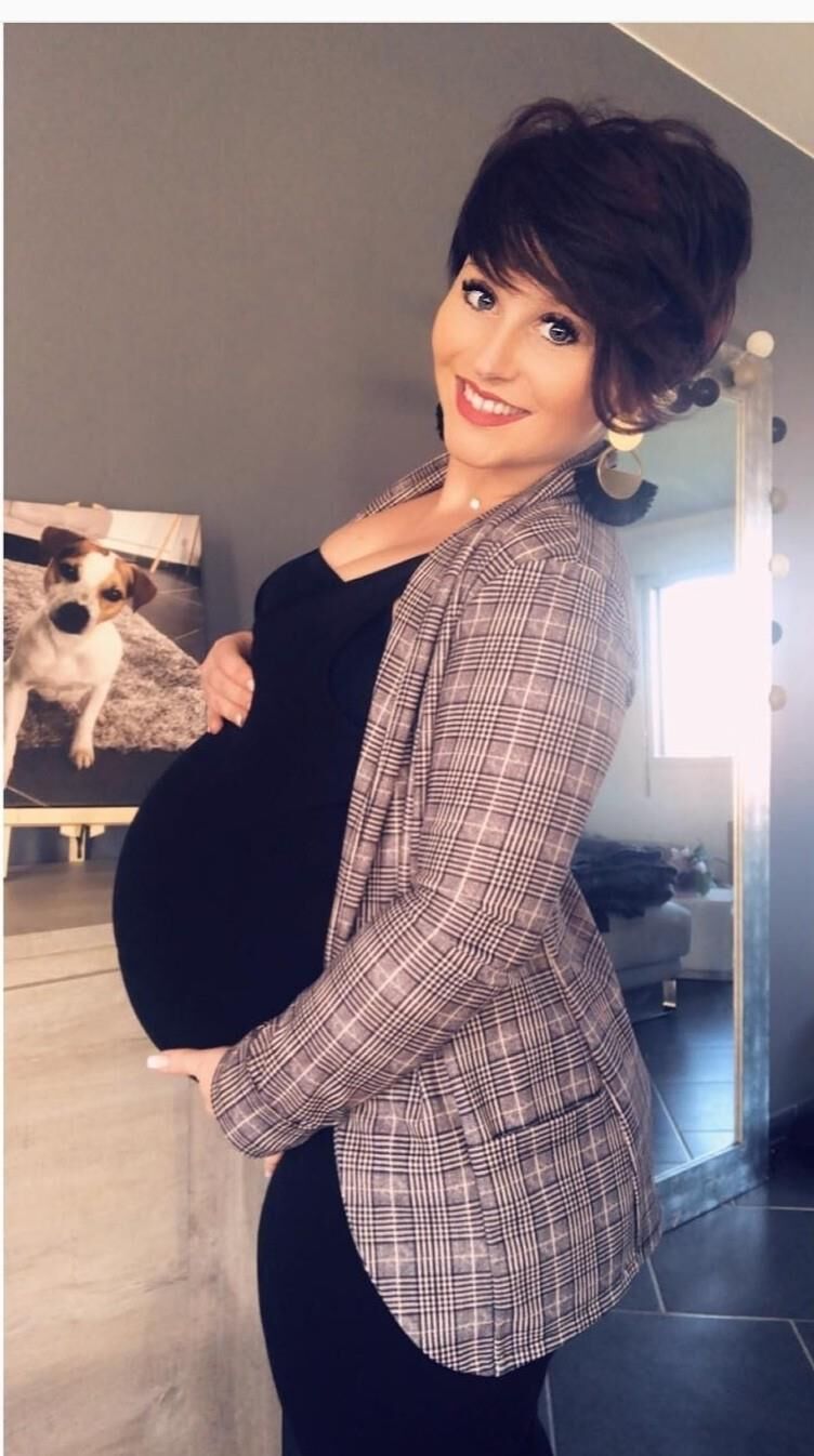 [Pregnant] woman very proud to show off her big belly