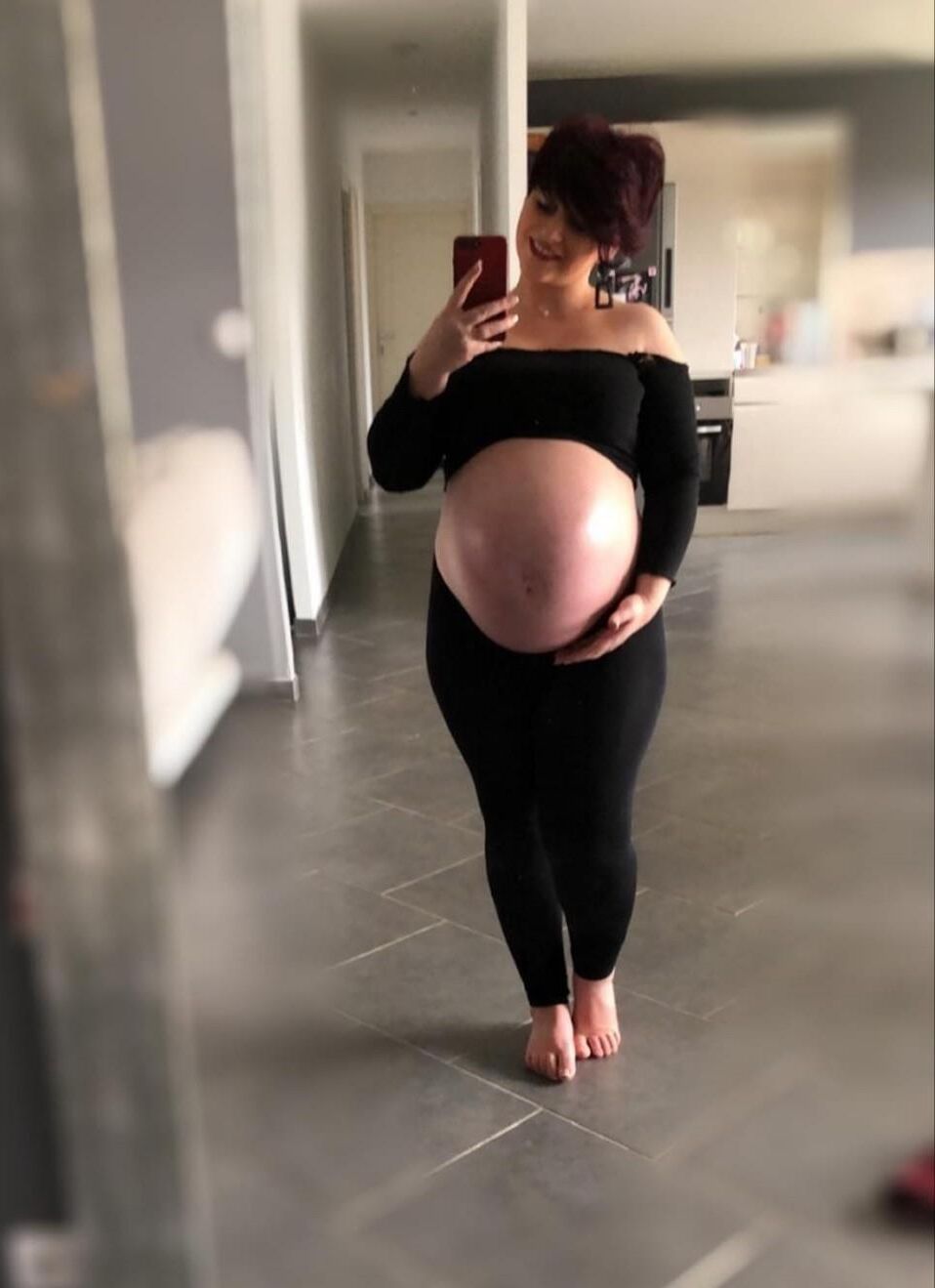 [Pregnant] woman very proud to show off her big belly