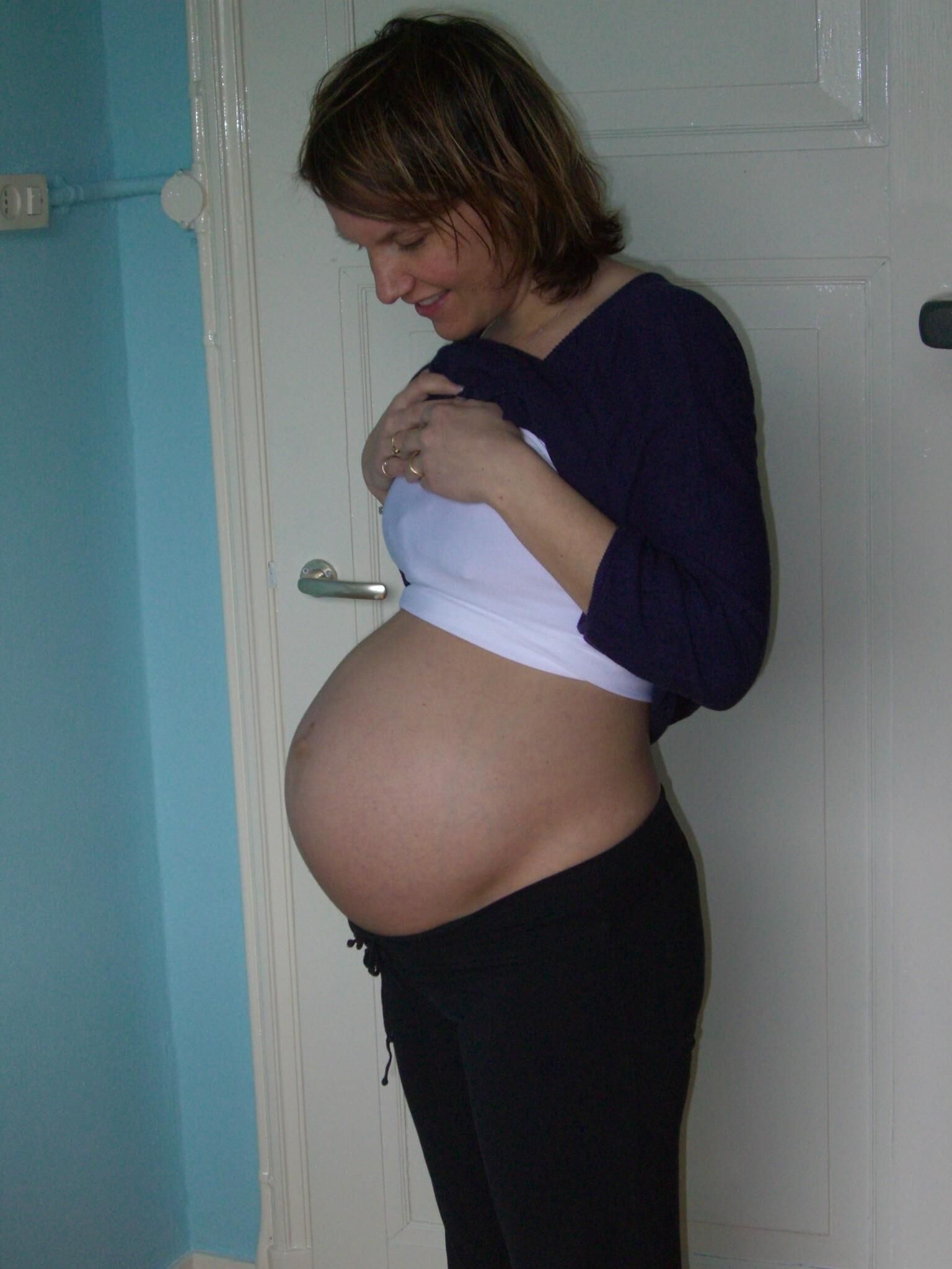 Mature pregnant woman reveals herself