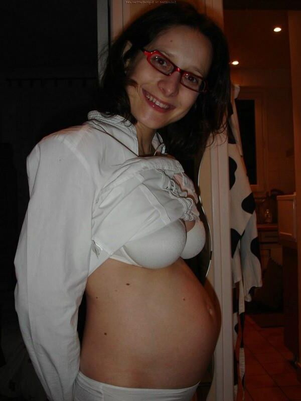 [Pregnant] woman showing off her breasts