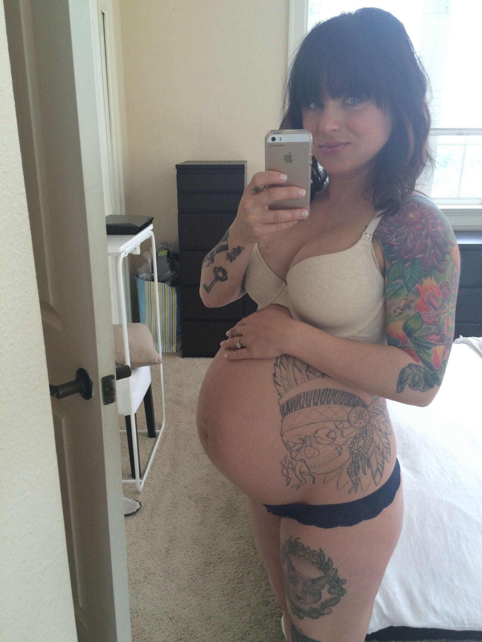 Green eyed pierced preggo