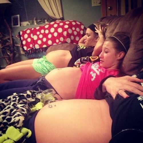 Multiple pregnant bellies - group