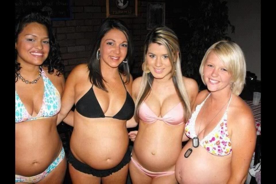 Multiple pregnant bellies - group