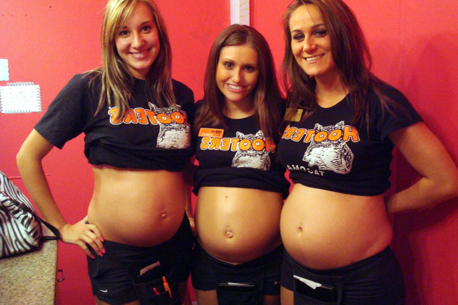 Multiple pregnant bellies - group