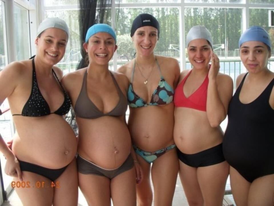 Multiple pregnant bellies - group