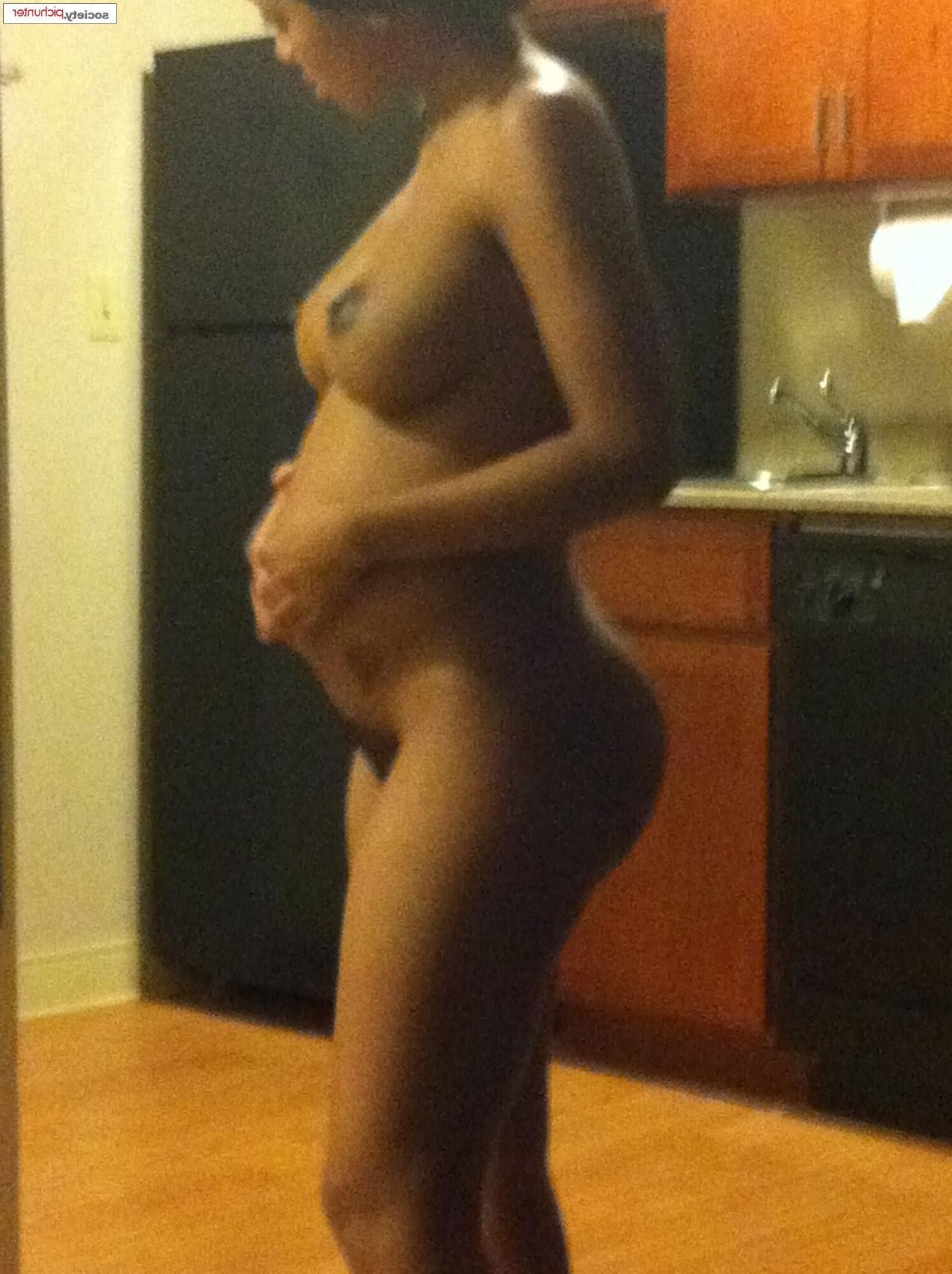 Pregnant black girl in the shower