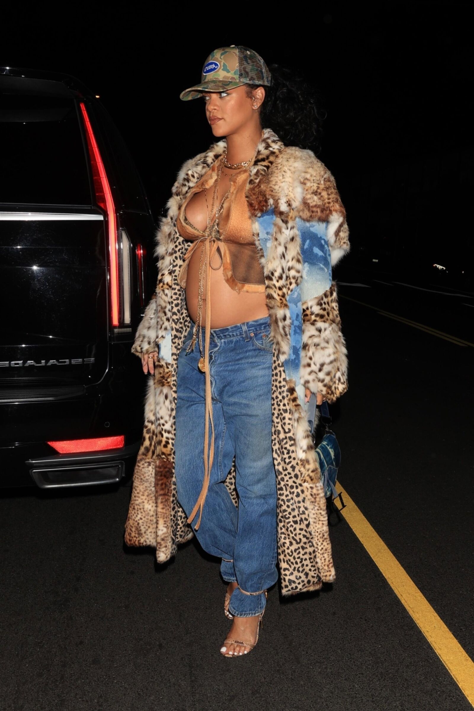 Rihanna shows off her belly bump while out to late night dinner