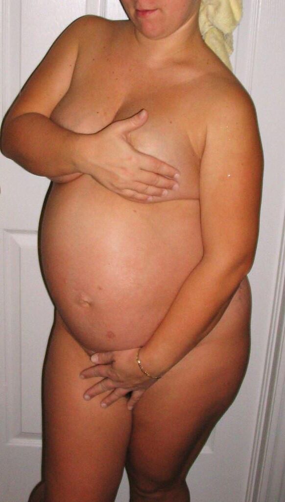 Very pregnant woman who likes to show her belly