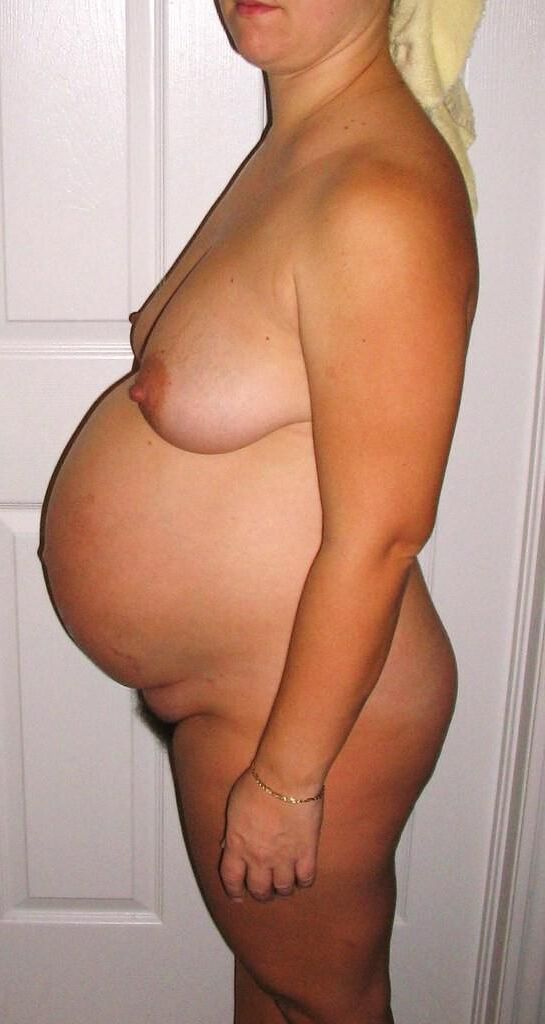 Very pregnant woman who likes to show her belly