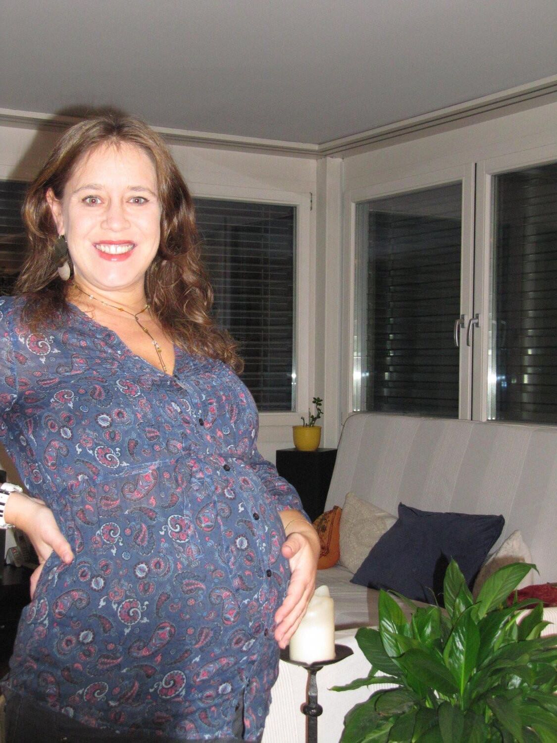 Pregnant wife exposes her big belly